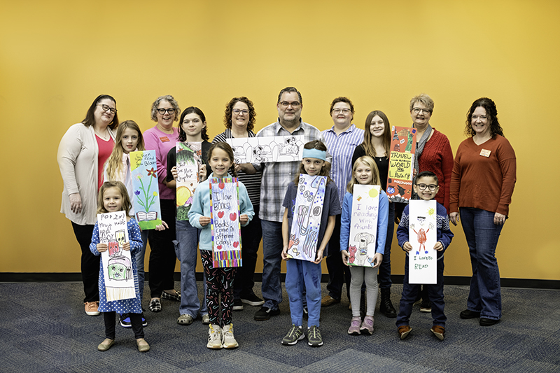Group photo of the 2023 Bookmark Contest winners and Friends board members